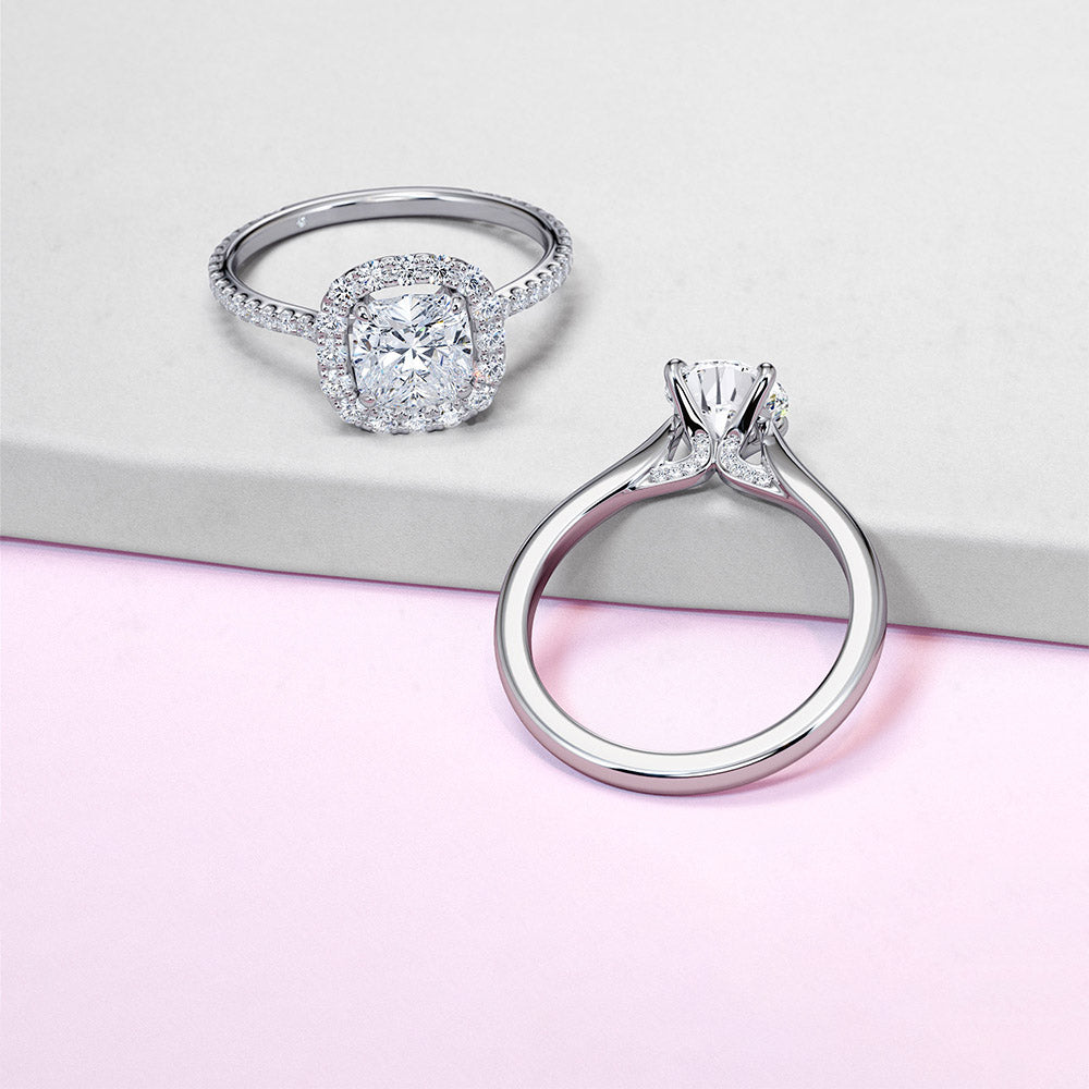 diamond certificate with loose diamond in tweezers