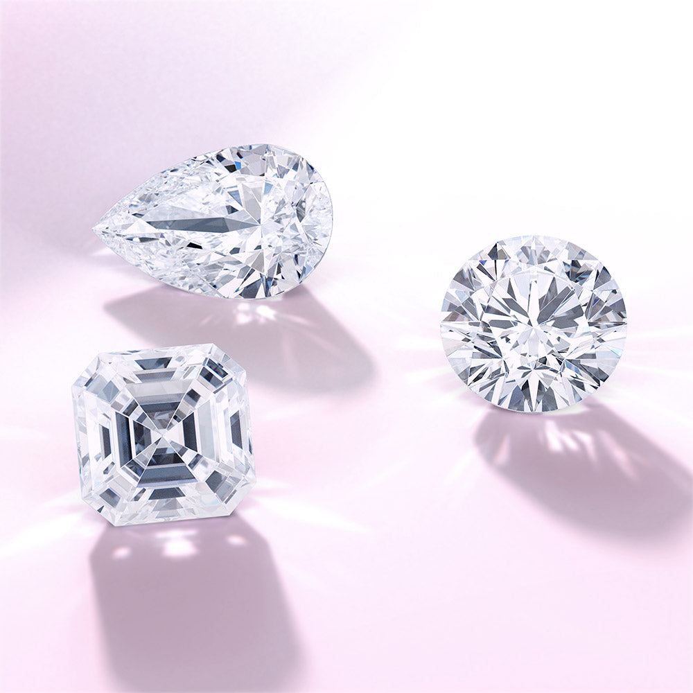 diamond certificate with loose diamond in tweezers